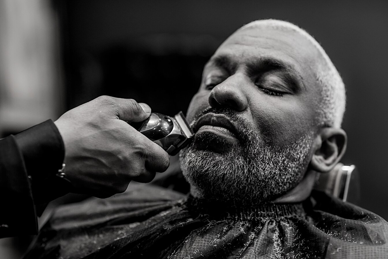 Handsome black man in a luxury barber shop